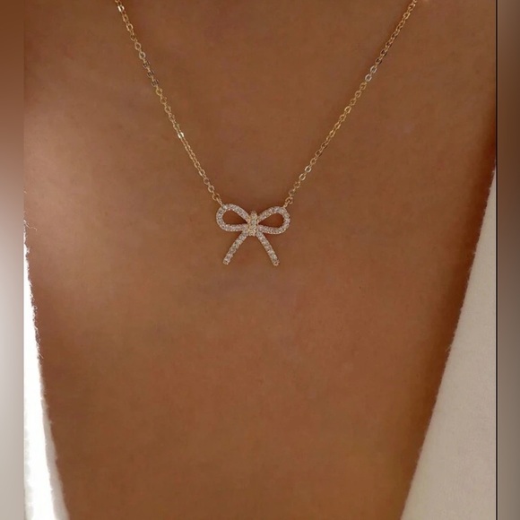 Anthropologie Jewelry - Anthropologie Silver Bow Gold Pendant Necklace